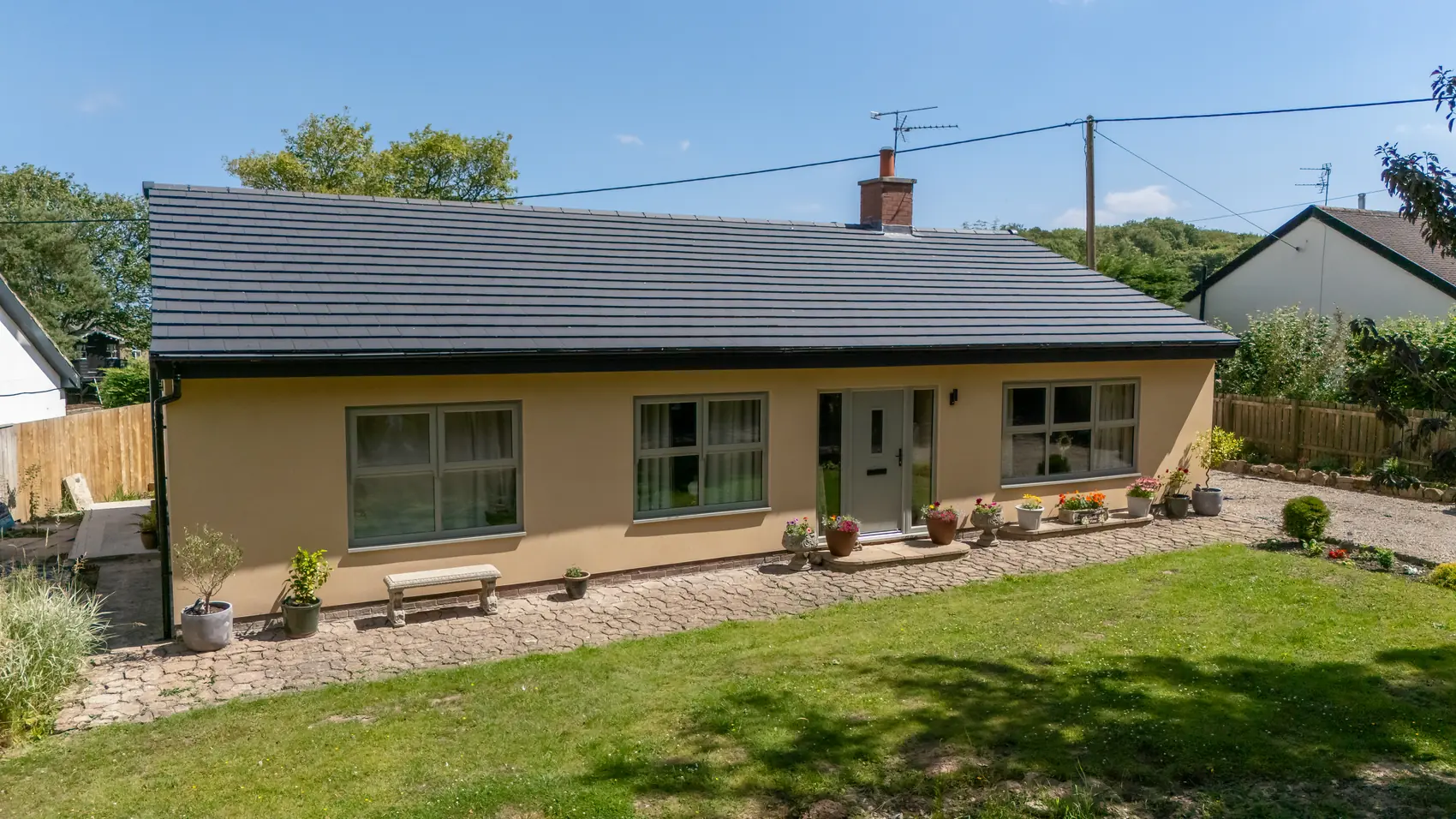 Fully renovated rendered bungalow with new roof and reinstated garden